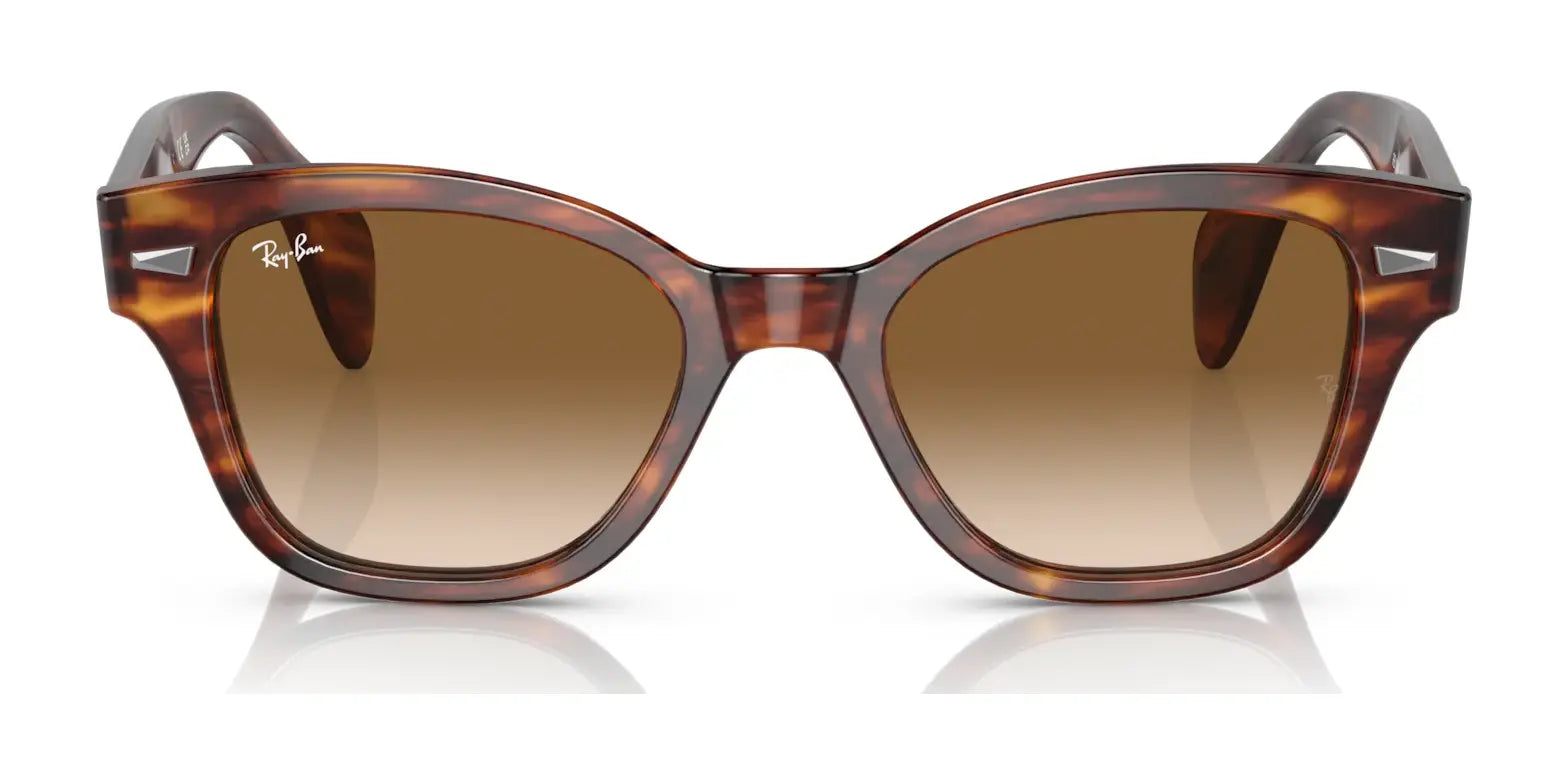 Embark on an outdoor adventure with Ray-Ban RB0880S Sunglasses, featuring tortoiseshell frames, gradient brown lenses, and UV protection against a classic white backdrop.