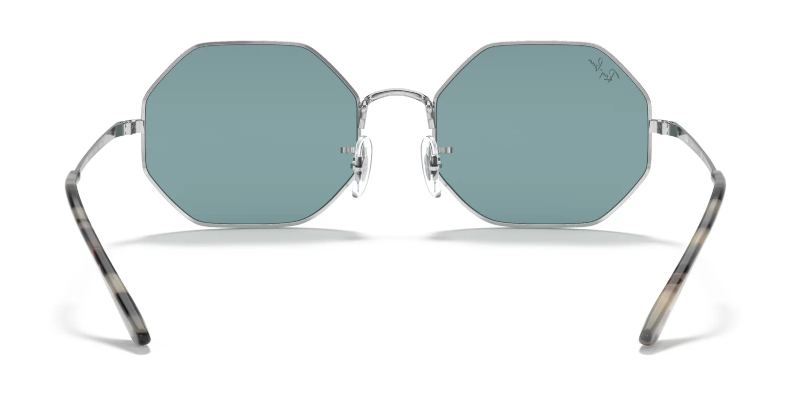 Ray-Ban OCTAGON RB1972 sunglasses in size 54, with geometric metal frames, a silver finish, and teal lenses, are shown from the front.