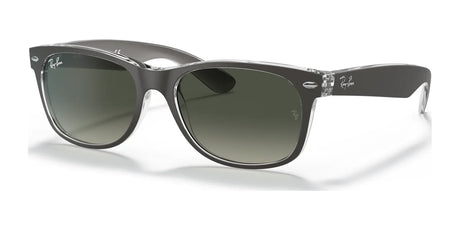 Stylishly protect yourself from the sun with Ray-Ban NEW WAYFARER RB2132 Sunglasses in size 52, featuring transparent frames, dark green lenses, and logo-adorned temples for a classic look that blends timeless elegance with modern flair.