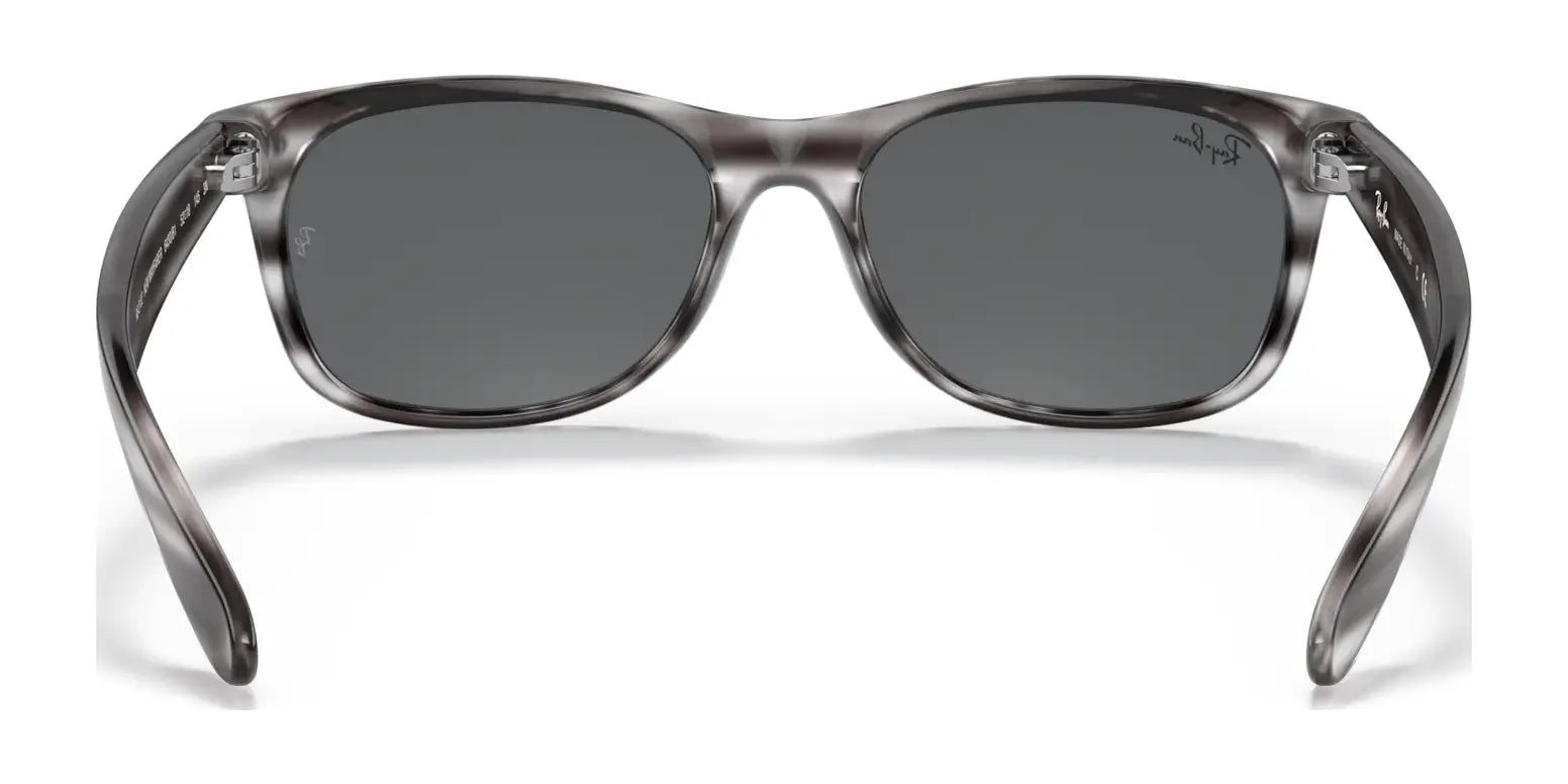 The Ray-Ban NEW WAYFARER RB2132 Sunglasses in size 52 feature a sleek gray frame with dark lenses, offering stylish sun protection. Photographed against a plain white background, these sunglasses make a bold yet classic statement.