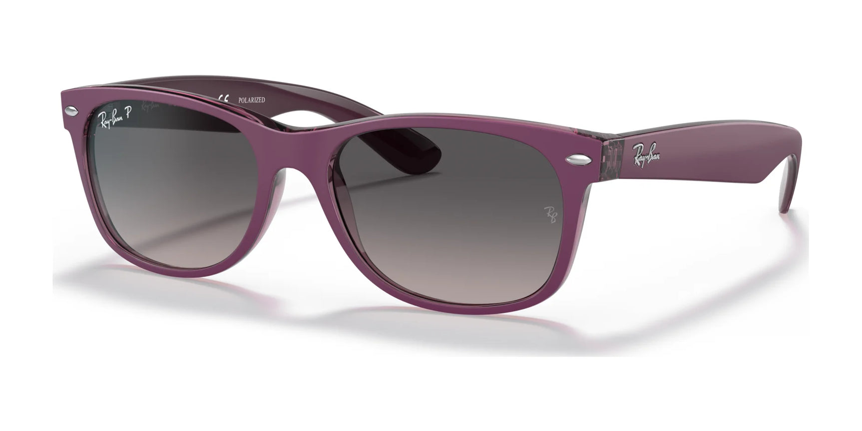 The Ray-Ban NEW WAYFARER RB2132 Sunglasses, Size 58, offer chic UV protection with stylish gradient lenses in a purple Wayfarer-style against a crisp white backdrop.