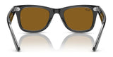 A pair of Ray-Ban WAYFARER RB2140F sunglasses with brown lenses, providing 100% UV protection, stylishly showcased from the back.