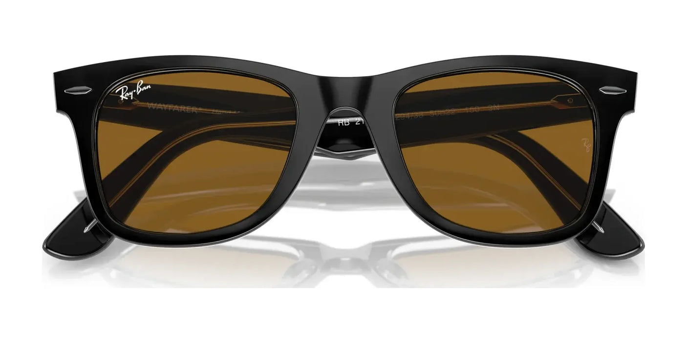 The Ray-Ban WAYFARER RB2140F sunglasses boast black frames with brown lenses and prominently showcase the brand logo in the top left corner, providing 100% UV protection.