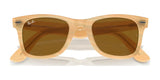 Ray-Ban WAYFARER RB2140F sunglasses in beige, featuring brown lenses and a logo on the top left lens, provide stylish UV protection.