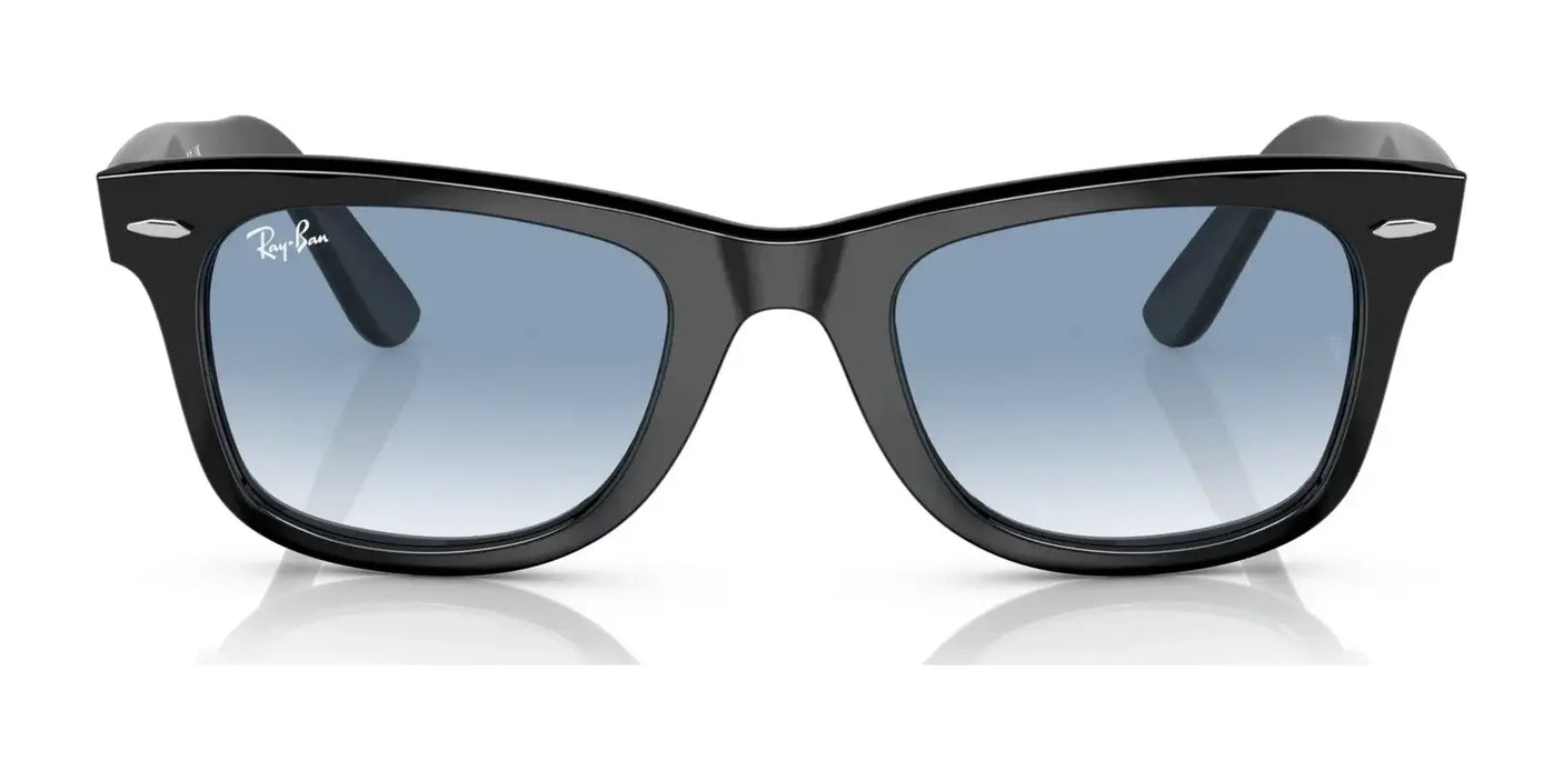 The Ray-Ban WAYFARER RB2140F Sunglasses from Ray-Ban offer a trendy look with their black frames and blue gradient lenses, ensuring stylish UV protection against a white backdrop.