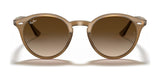 Ray-Ban RB2180F sunglasses, featuring an oval shape with brown-tinted lenses and translucent frames, offer timeless style and UV protection against a white background.