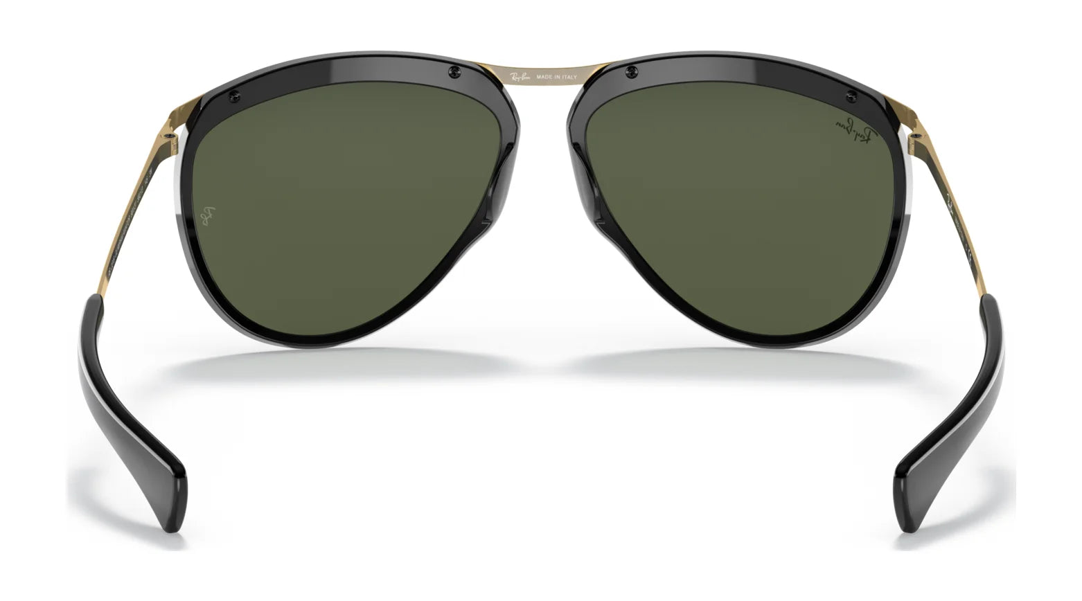 The Ray-Ban OLYMPIAN AVIATOR RB2219 Sunglasses, Size 59, boast sleek black frames, green UV-protected lenses with gold accents, and a signature on the top right lens.