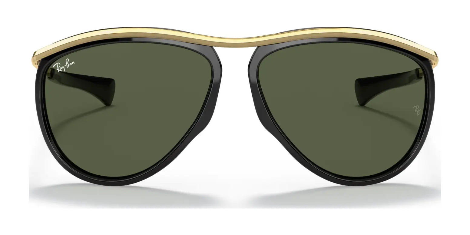 The Ray-Ban OLYMPIAN AVIATOR RB2219 Sunglasses, with black frames, a gold brow bar, and UV-protected green lenses, epitomize timeless style on a white background.