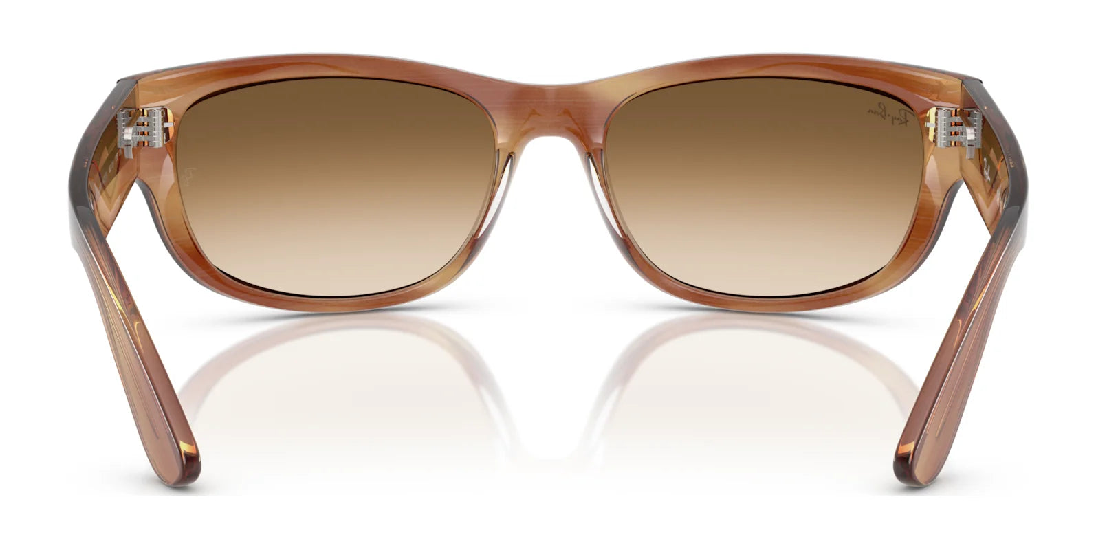 The Ray-Ban MEGA BALORAMA RB2289 sunglasses showcase a sporty design with brown gradient lenses and transparent frames against a white backdrop, offering sleek style and polarized eye protection.