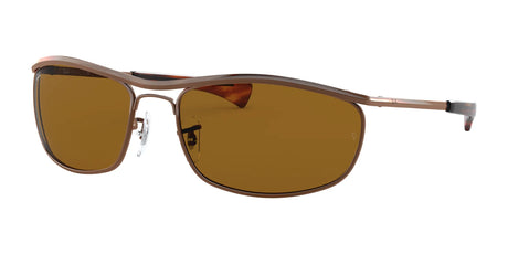 Ray-Ban OLYMPIAN I DELUXE RB3119M Sunglasses, size 62, feature a sleek metallic frame with stylish rectangular brown lenses that combine fashion and essential UV protection against a crisp white backdrop.