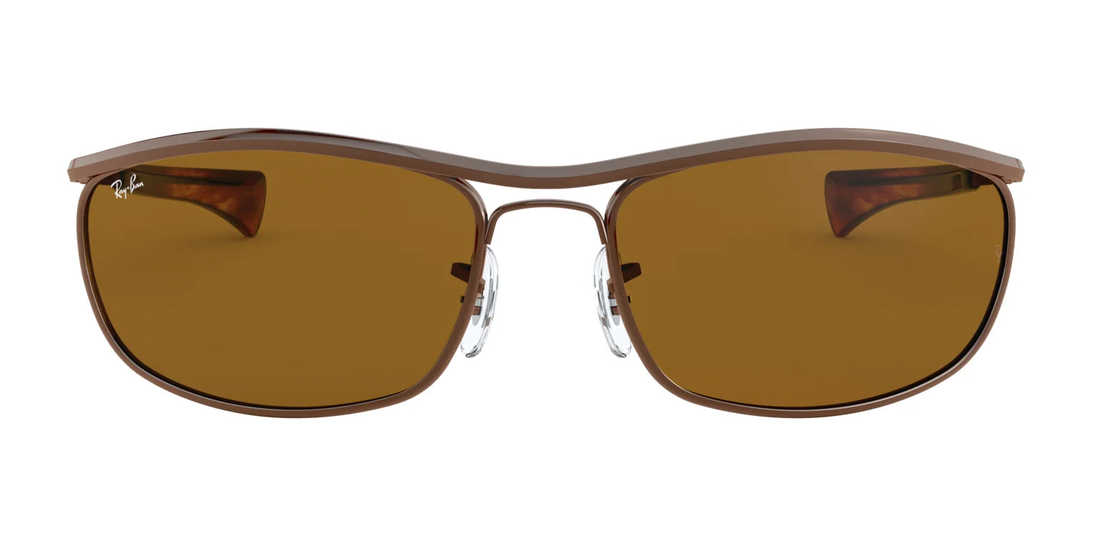 The Ray-Ban OLYMPIAN I DELUXE RB3119M Sunglasses, Size 62, boast a sleek metallic frame and brown lenses for a sophisticated look with essential UV protection.