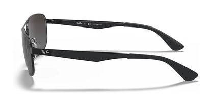 Side view of the Ray-Ban RB3528 Sunglasses in black, featuring polarized lenses and thick black arms with brand logos. These stylish sunglasses also provide excellent UV protection.