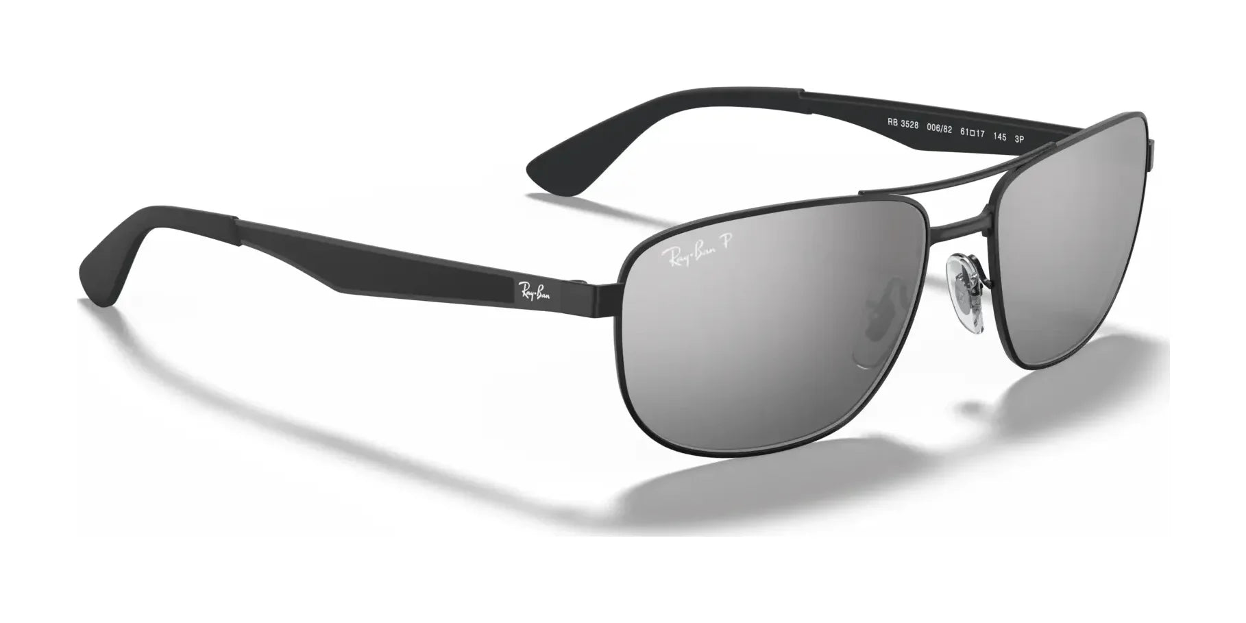 Ray-Ban RB3528 Sunglasses by Ray-Ban feature black frames and silver reflective lenses with the iconic logo on the top right of each lens, offering both UV protection and a stylish appeal, available in Size 61.