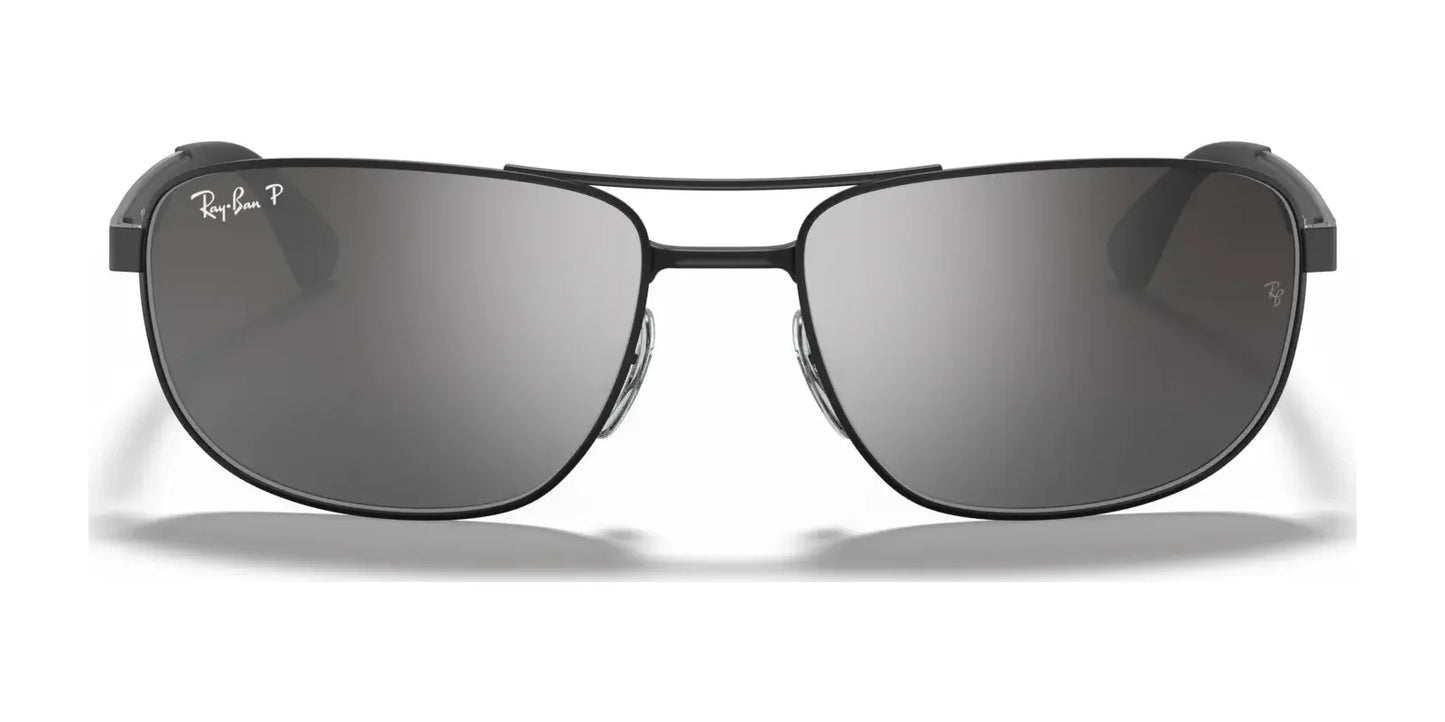 Front view of the stylish Ray-Ban RB3528 Sunglasses in Size 61, featuring dark lenses and a thin frame complete with the iconic Ray-Ban logo on the lens. These chic sunnies offer impeccable UV protection while enhancing your fashion statement.