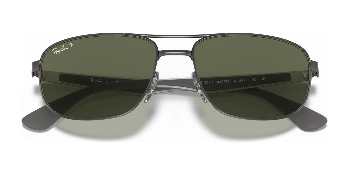 Front view of Ray-Ban RB3528 aviator-style sunglasses featuring a metallic frame and dark green lenses, providing stylish sunnies with UV protection.