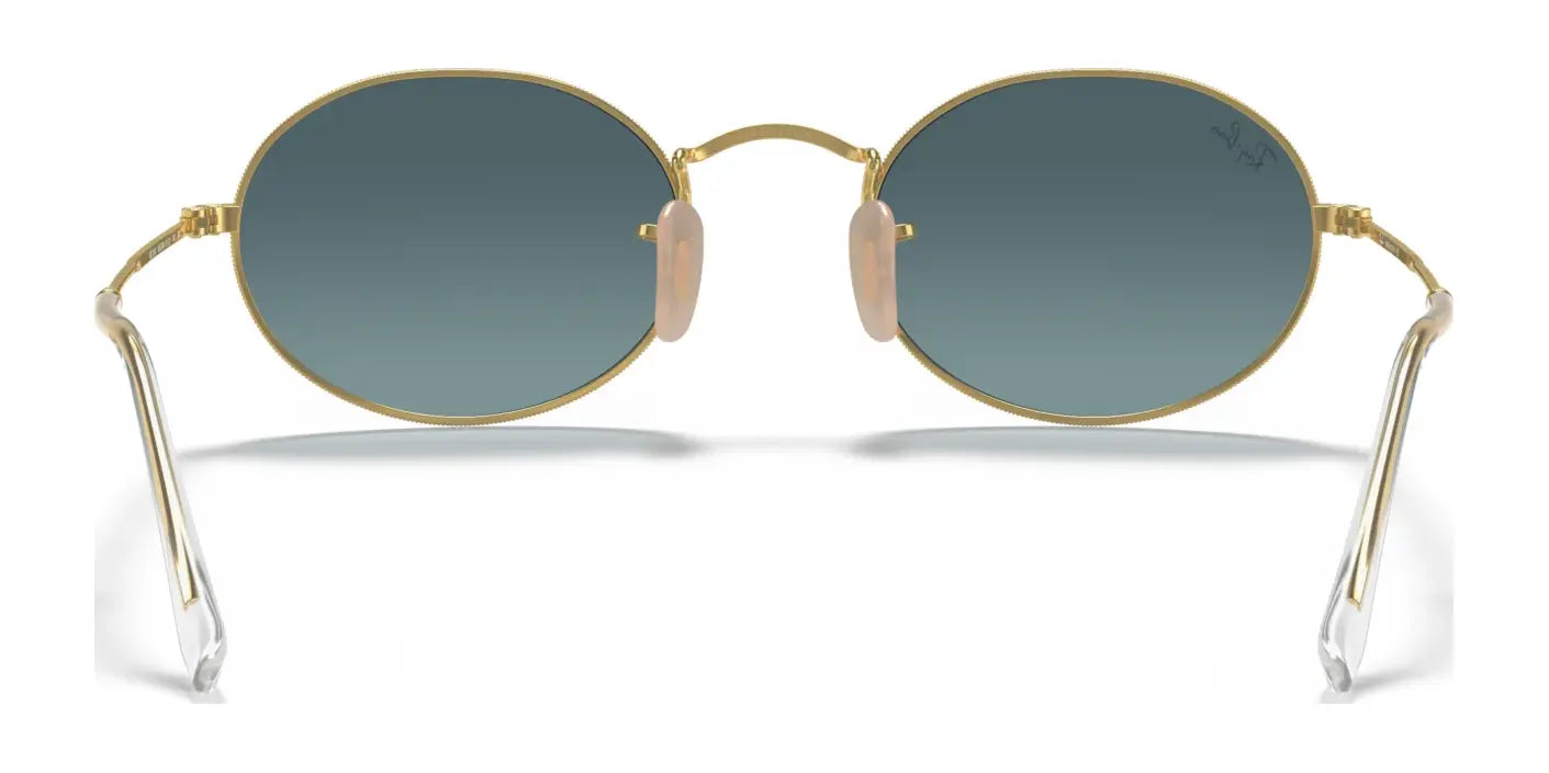 The Ray-Ban OVAL RB3547 Sunglasses feature round, gold frames with dark lenses, crafted from premium materials for a timeless look.