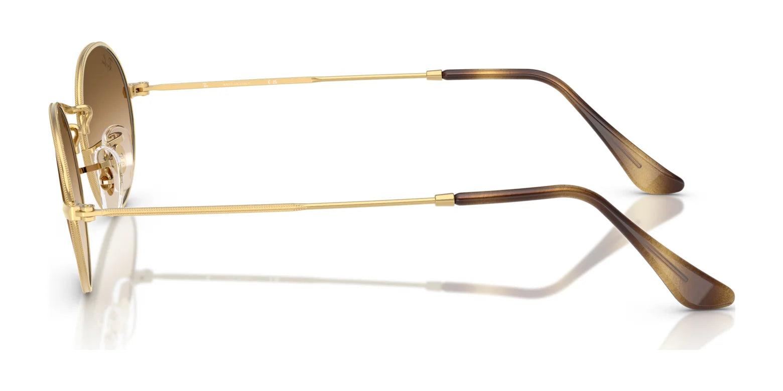 The Ray-Ban OVAL RB3547 sunglasses feature gold-rimmed aviator frames with brown gradient lenses and sleek arms, crafted from premium materials, viewed from the side.