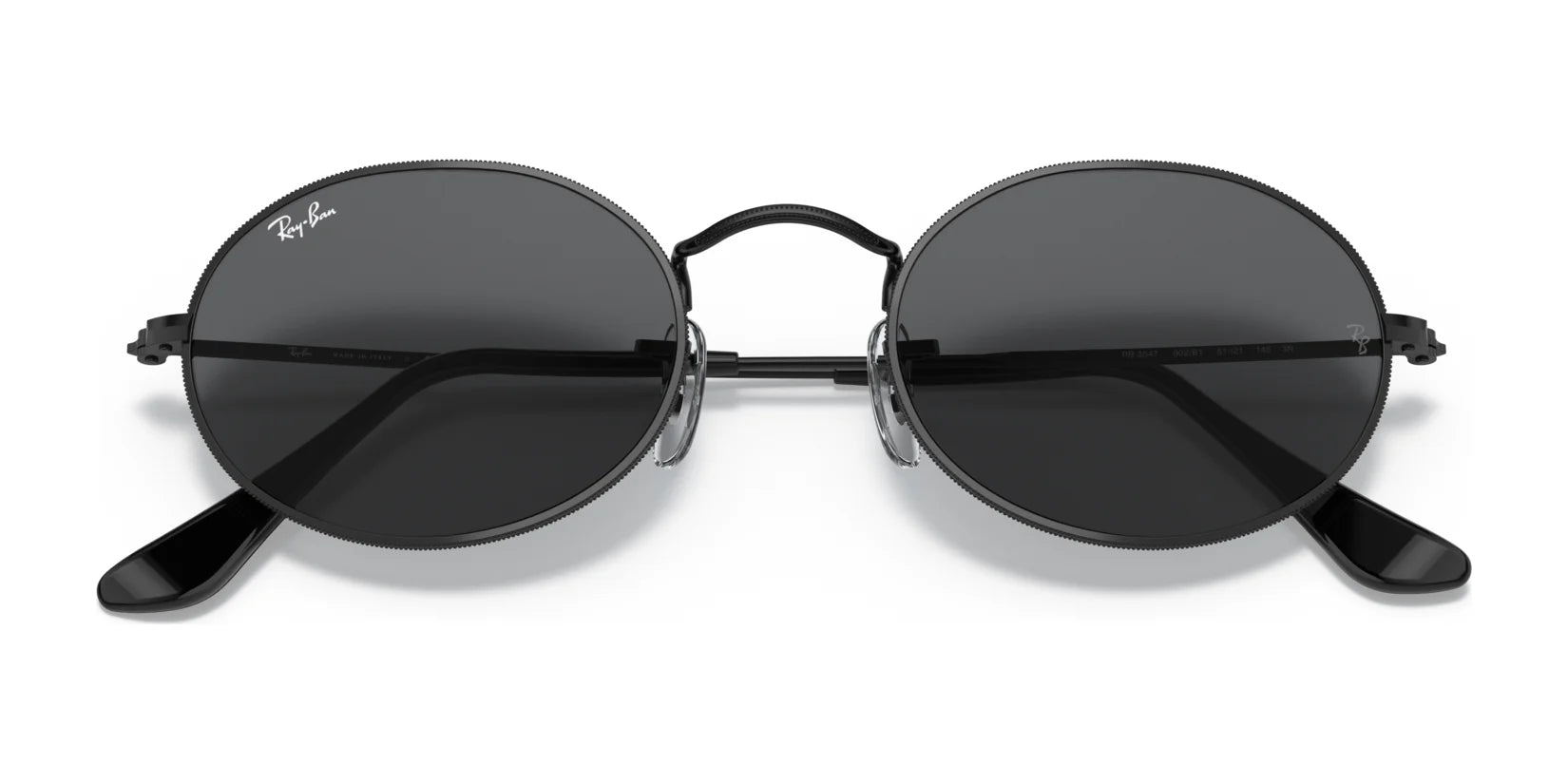 The Ray-Ban OVAL RB3547 sunglasses feature round black lenses and thin metal frames, crafted from premium materials.