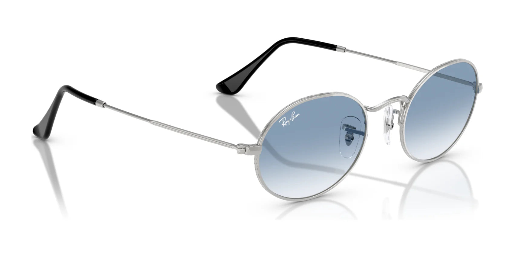 These Ray-Ban OVAL RB3547 sunglasses boast round blue-tinted lenses, thin silver frames, and black temple tips, highlighting premium materials for a chic style.