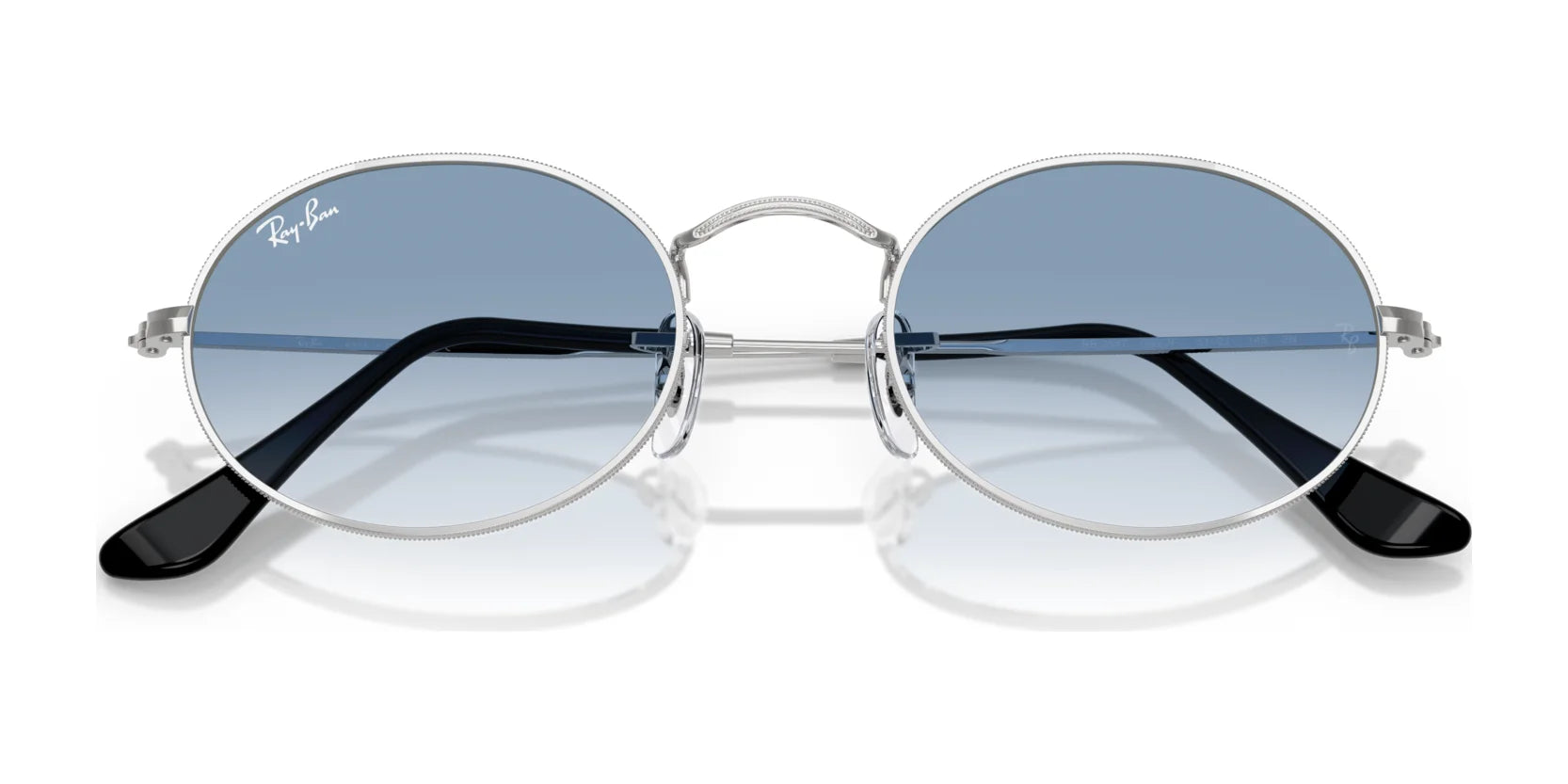 The Ray-Ban OVAL RB3547 sunglasses showcase an elegant round design with silver frames and blue lenses, expertly crafted from high-quality materials, viewed head-on.