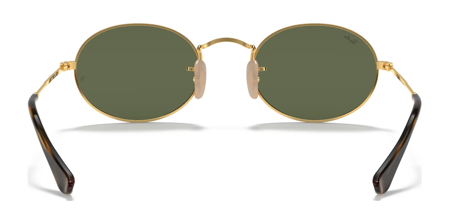 The Ray-Ban OVAL RB3547N Sunglasses showcase an elegant oval design with gold frames, green UV 400 lenses, and dark brown temple tips when viewed from the front.