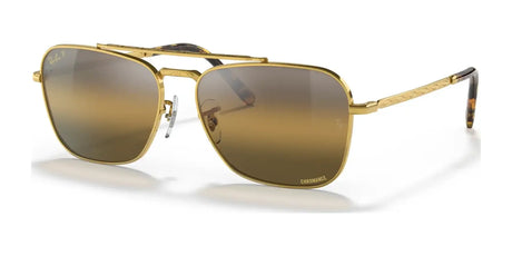 Ray-Ban NEW CARAVAN RB3636 Sunglasses with gold frames and brown gradient lenses elegantly showcased against a white background.