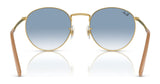 The Ray-Ban NEW ROUND RB3637 sunglasses feature round gold frames with premium engravings on the bridge, stylish blue gradient crystal lenses, and light brown arms.