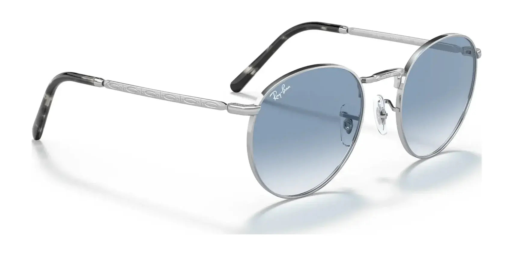 The Ray-Ban NEW ROUND RB3637 Sunglasses feature a thin metallic frame, crystal blue-tinted lenses, and black temple tips.