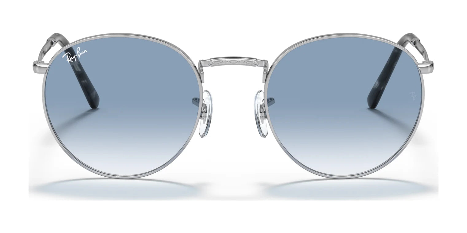 Ray-Ban NEW ROUND RB3637 Sunglasses feature crystal blue-tinted lenses, sleek silver frames, and thin black temples, elegantly displayed against a pristine white background.