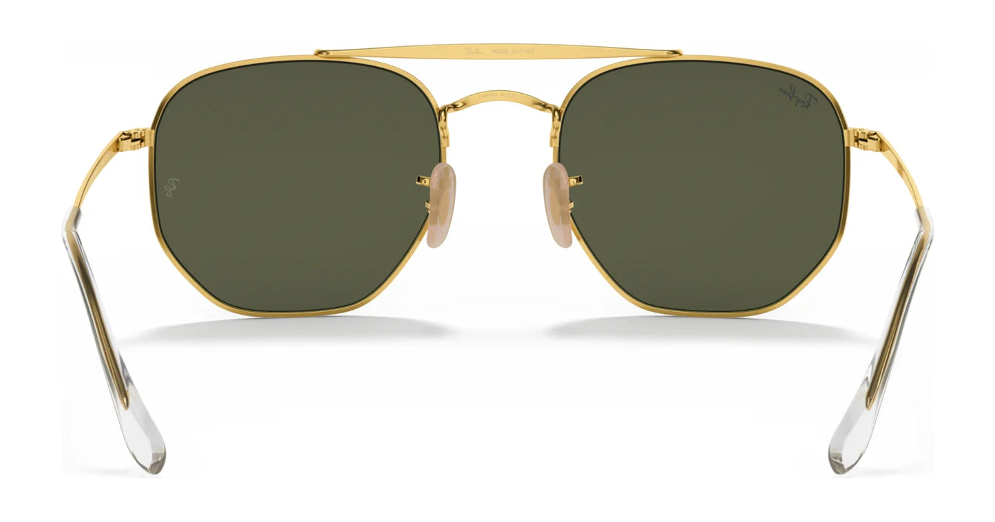 Hexagonal gold-framed Ray-Ban THE MARSHAL RB3648 sunglasses in size 54, featuring high-quality dark green lenses, clear earpieces, and adjustable nose pads.