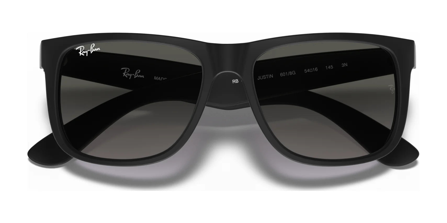 The Ray-Ban JUSTIN RB4165 Sunglasses feature a sleek black design with rectangular lenses and the iconic logo on the frame, providing 100% UV protection.