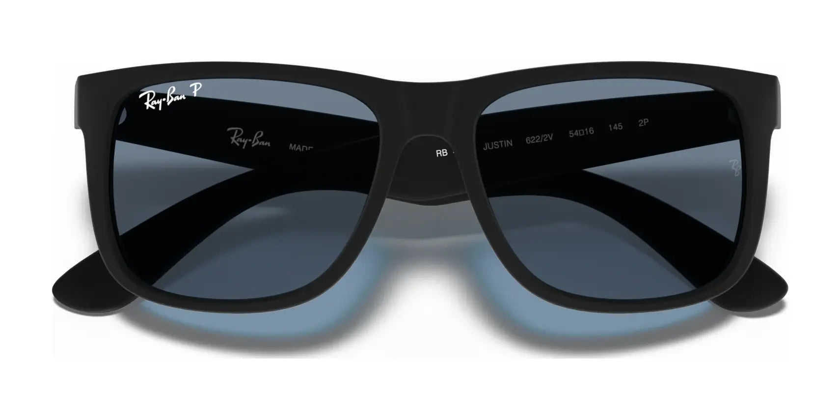 Ray-Ban JUSTIN RB4165 sunglasses feature reflective lenses, a square shape, and 100% UV protection against a striking white backdrop.