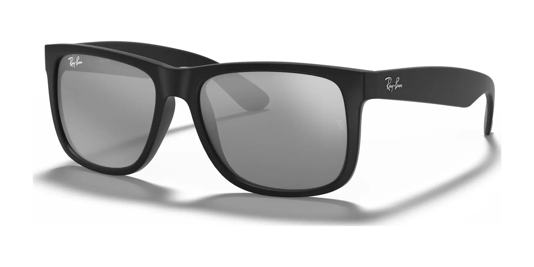 Ray-Ban JUSTIN RB4165 sunglasses in Rubber Black №622/6G, featuring gray lenses and 100% UV protection, rest elegantly on a white surface.