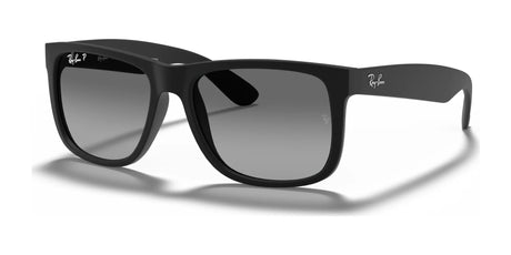 The Ray-Ban JUSTIN RB4165 sunglasses in Rubber Black №622/T3 feature a sleek silver logo on the temples and gradient lenses, offering 100% UV protection. These square-frame sunglasses perfectly blend fashion with functionality.