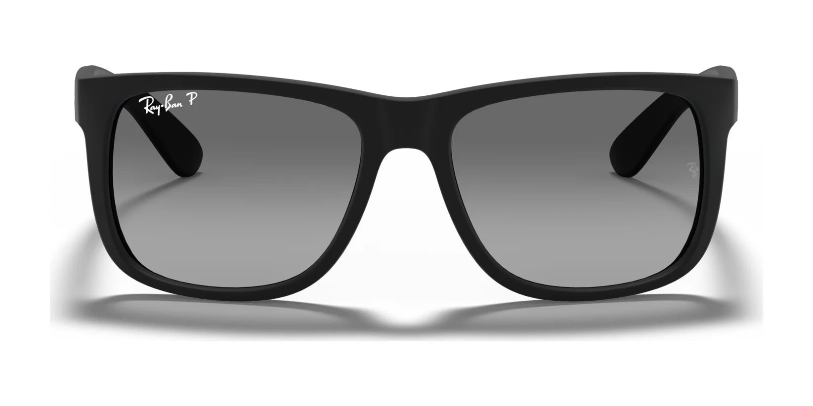 The Ray-Ban JUSTIN RB4165 sunglasses feature a matte square frame and dark lenses, delivering 100% UV protection against a clean white background.