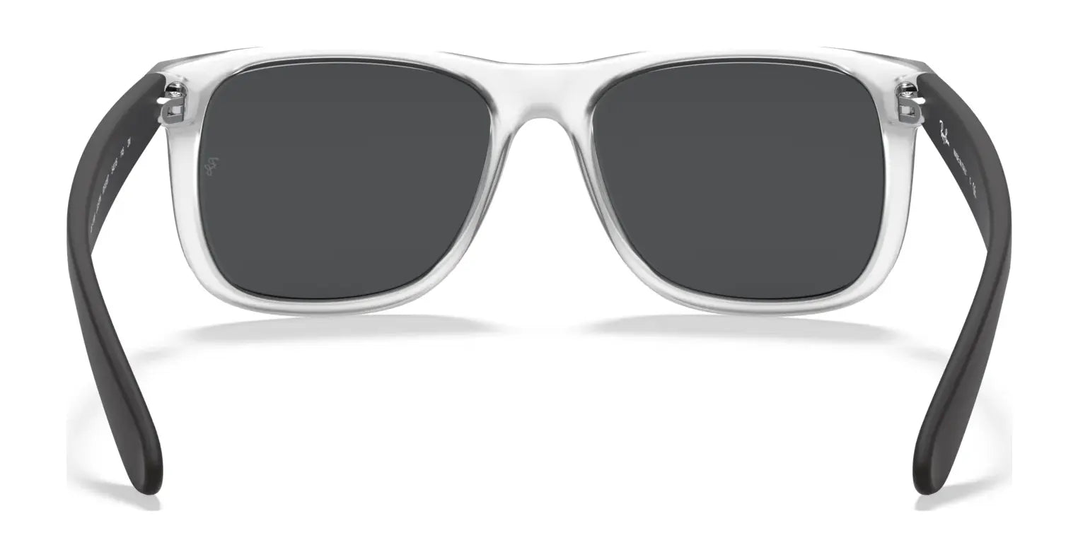 Ray-Ban JUSTIN RB4165 Sunglasses boast a sleek square shape with clear frames, dark lenses, and black temples against a white background. Enjoy 100% UV protection while making a bold style statement.