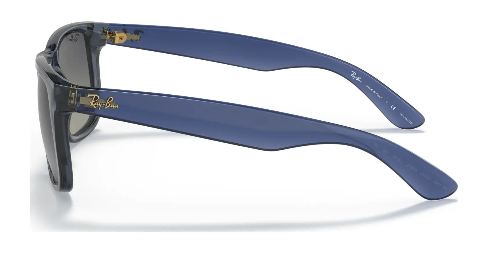 Side view of Ray-Ban JUSTIN RB4165 square sunglasses showcasing blue frames, dark lenses, a gold logo on the temple, and 100% UV protection.