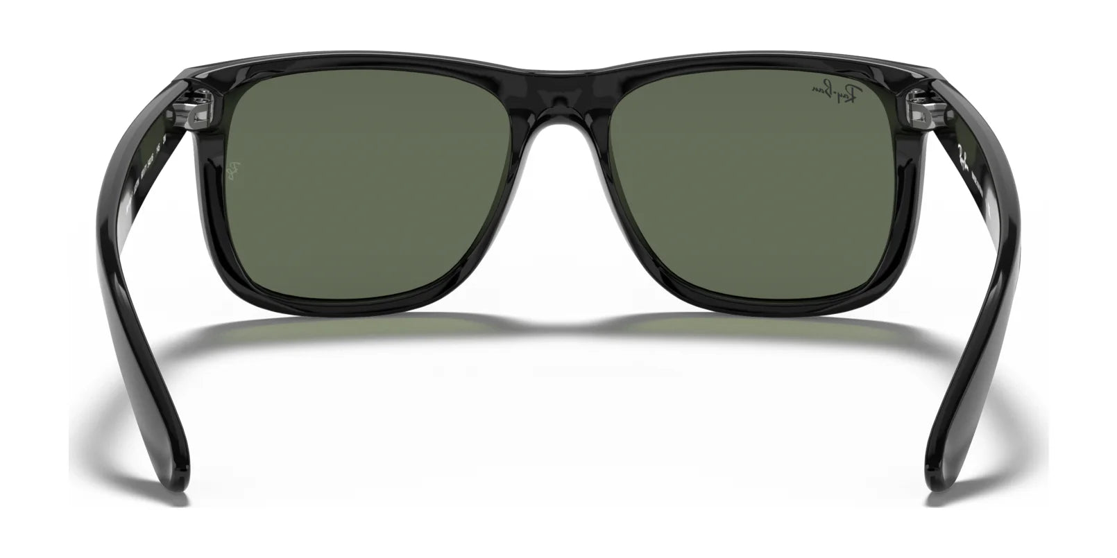 The Ray-Ban JUSTIN RB4165F sunglasses feature a sleek modern design with black square frames and green lenses, offering stylish UV protection.