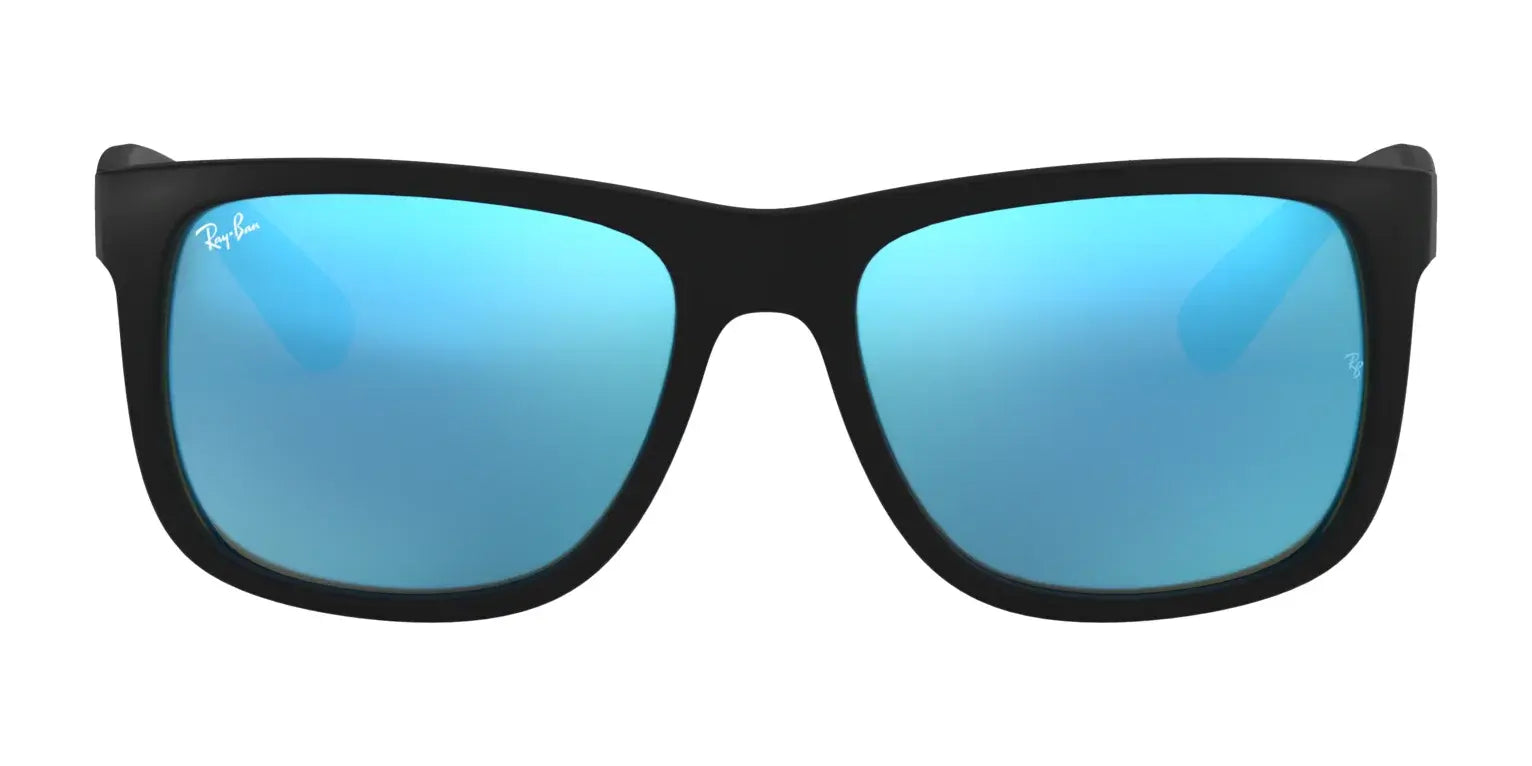 The Ray-Ban JUSTIN RB4165F sunglasses feature sleek black frames with blue reflective lenses, offering style and UV protection against a pristine white background.