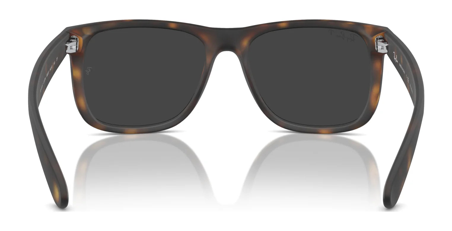 The Ray-Ban JUSTIN RB4165F sunglasses showcase a tortoiseshell square frame with reflective black lenses, providing essential UV protection.