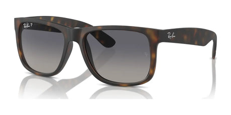 Ray-Ban JUSTIN RB4165F sunglasses feature a Havana tortoiseshell color with a square frame, dark UV-protected lenses, and a small logo on the arms.