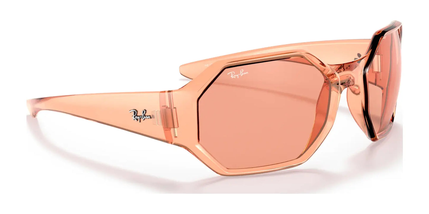 The Ray-Ban RB4337 Sunglasses in size 59 feature a clear pink hexagonal design, iconic logo on both the temple and lens, and provide UV protection while resting stylishly on a white background.