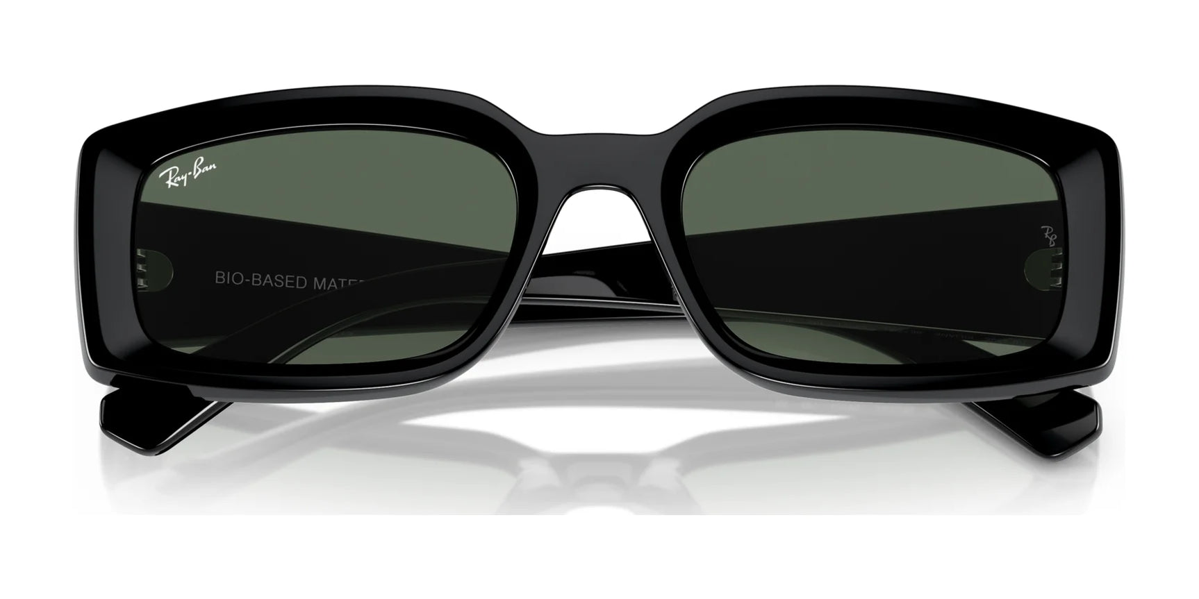 The Ray-Ban KILIANE RB4395 sunglasses in size 54 feature a sleek black rectangular design with green lenses, made from bio-based acetate for excellent UV protection and a stylish look on a white background.