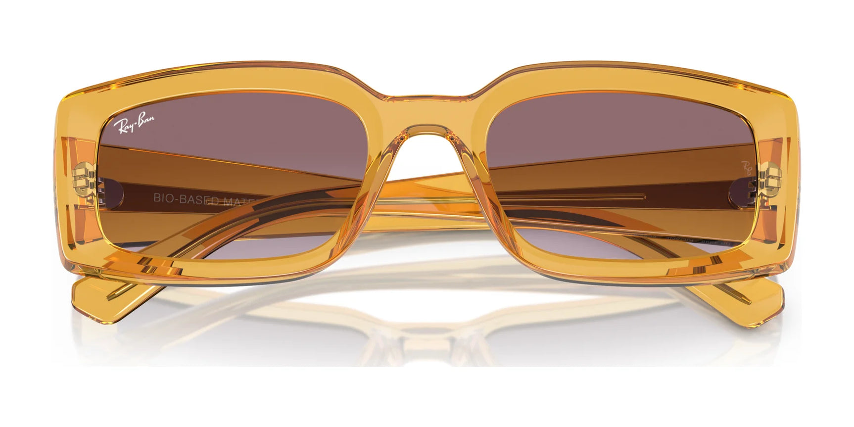 Ray-Ban KILIANE RB4395 sunglasses, size 54, feature a yellow square frame and brown lenses made from bio-based acetate. Folded on a reflective surface, these stylish shades offer essential UV protection.