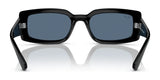 Front view of Ray-Ban KILIANE RB4395F Sunglasses, black with square frames and dark lenses, resting on a reflective surface, showcasing luxurious style.