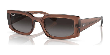 Rectangular Ray-Ban KILIANE RB4395F sunglasses crafted from premium materials, featuring transparent brown frames, dark lenses, and logoed temples.