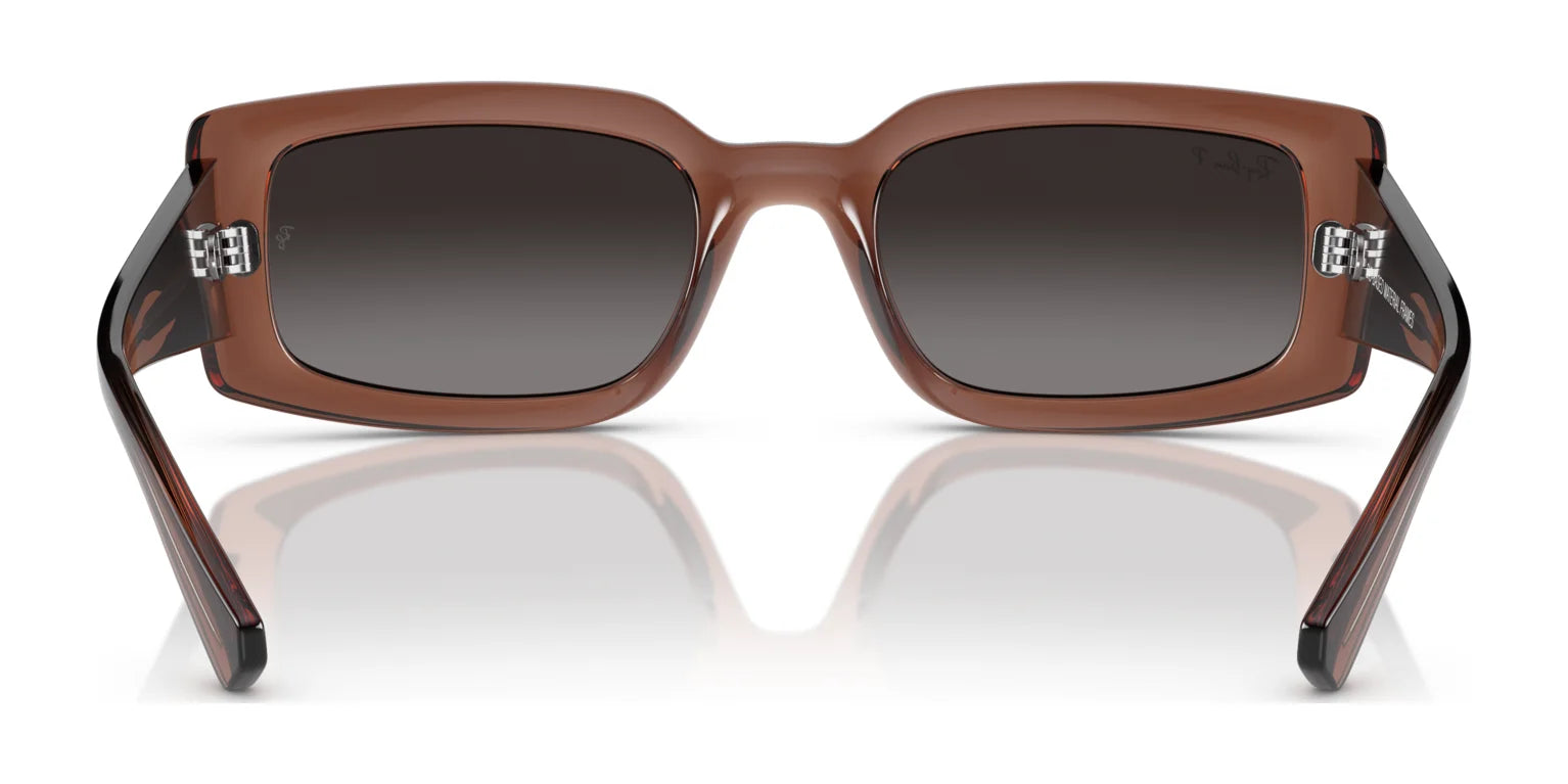 The Ray-Ban KILIANE RB4395F sunglasses feature luxurious brown rectangular frames with high-quality dark lenses, offering a sophisticated frontal view.