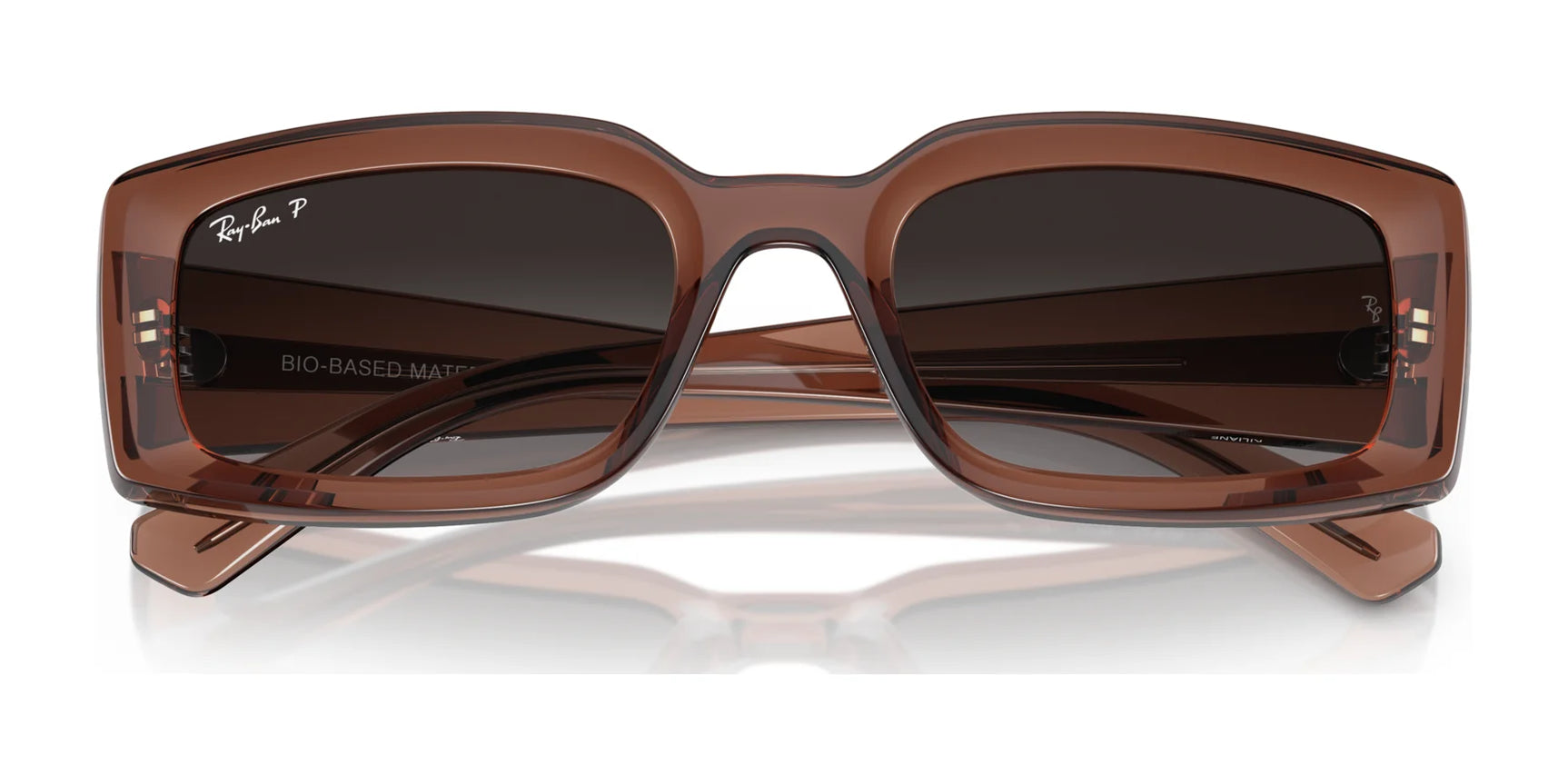 Indulge in luxury with Ray-Ban KILIANE RB4395F Sunglasses. These sleek brown, rectangular frames boast tinted lenses with the iconic "Ray-Ban" logo on the upper left lens, seamlessly merging style and elegance.