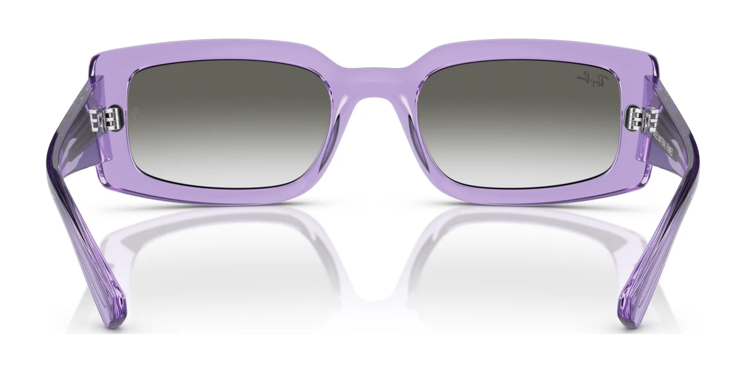 The Ray-Ban KILIANE RB4395F Sunglasses, featuring a purple rectangular frame and gradient lenses, are elegantly displayed from the front on a reflective surface.