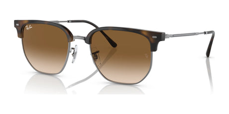 The Ray-Ban NEW CLUBMASTER RB4416 sunglasses feature brown aviator design, metal frames, and gradient lenses. They provide UV protection, combining style and function for a sunny day, echoing the classic Ray-Ban appeal.